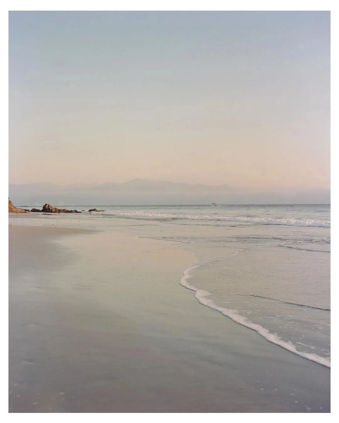 Pastel shoreline at dusk